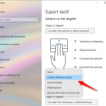 Selectarea acțiunii realizate la atingerea touchpad-ului cu trei sau patru degete