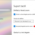 Setarea touchpad-ului pentru a face zoom atunci când apropii sau depărtezi două degete pe el