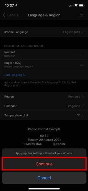 Tap Apasă Continue în fereastra pop-up pentru a schimba limba pe iPhone sau iPad